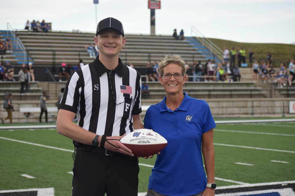 Dr. Heather Gulgin Hands Over the Game Ball Spotlight